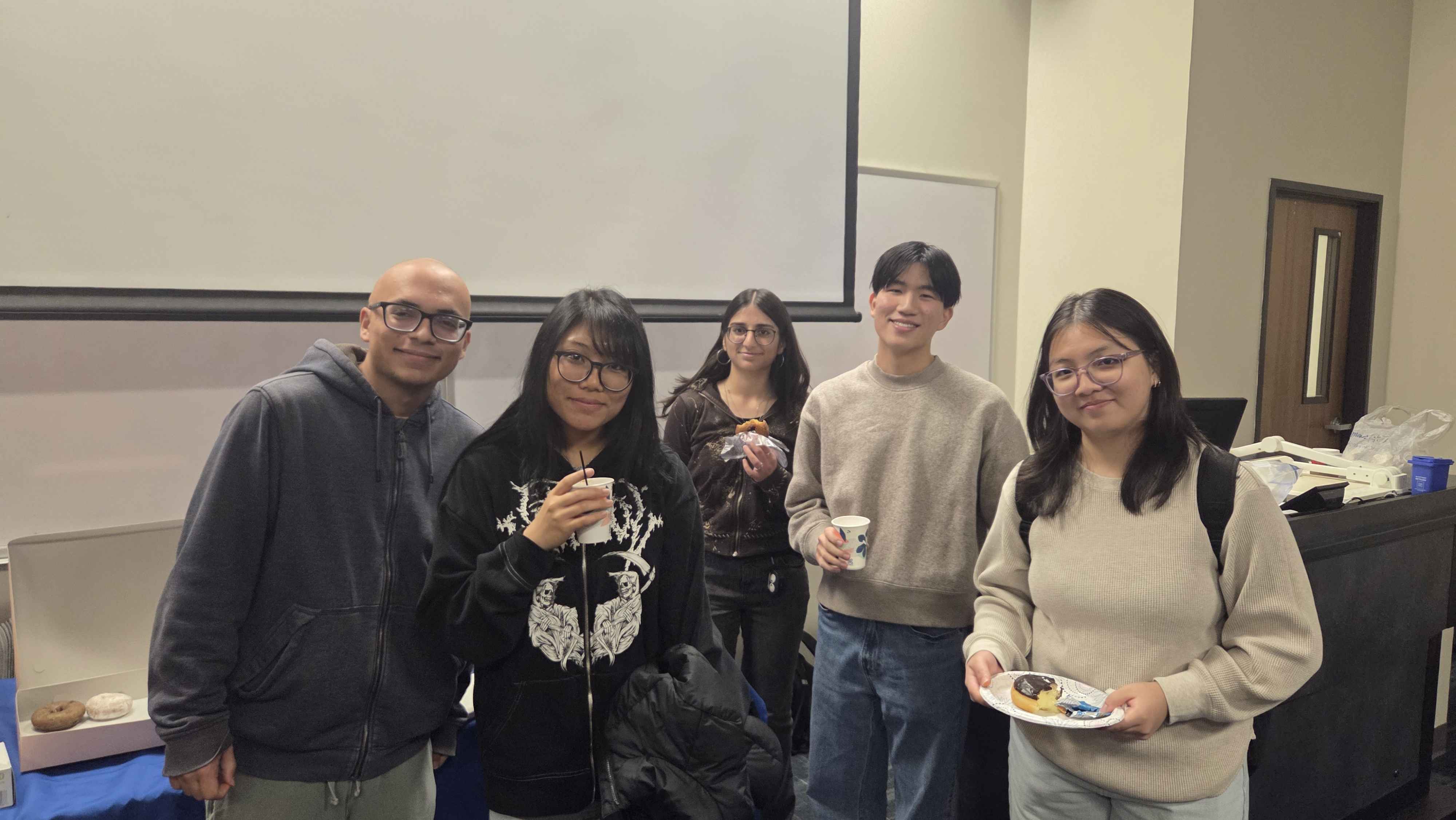 ACM members eating donuts
